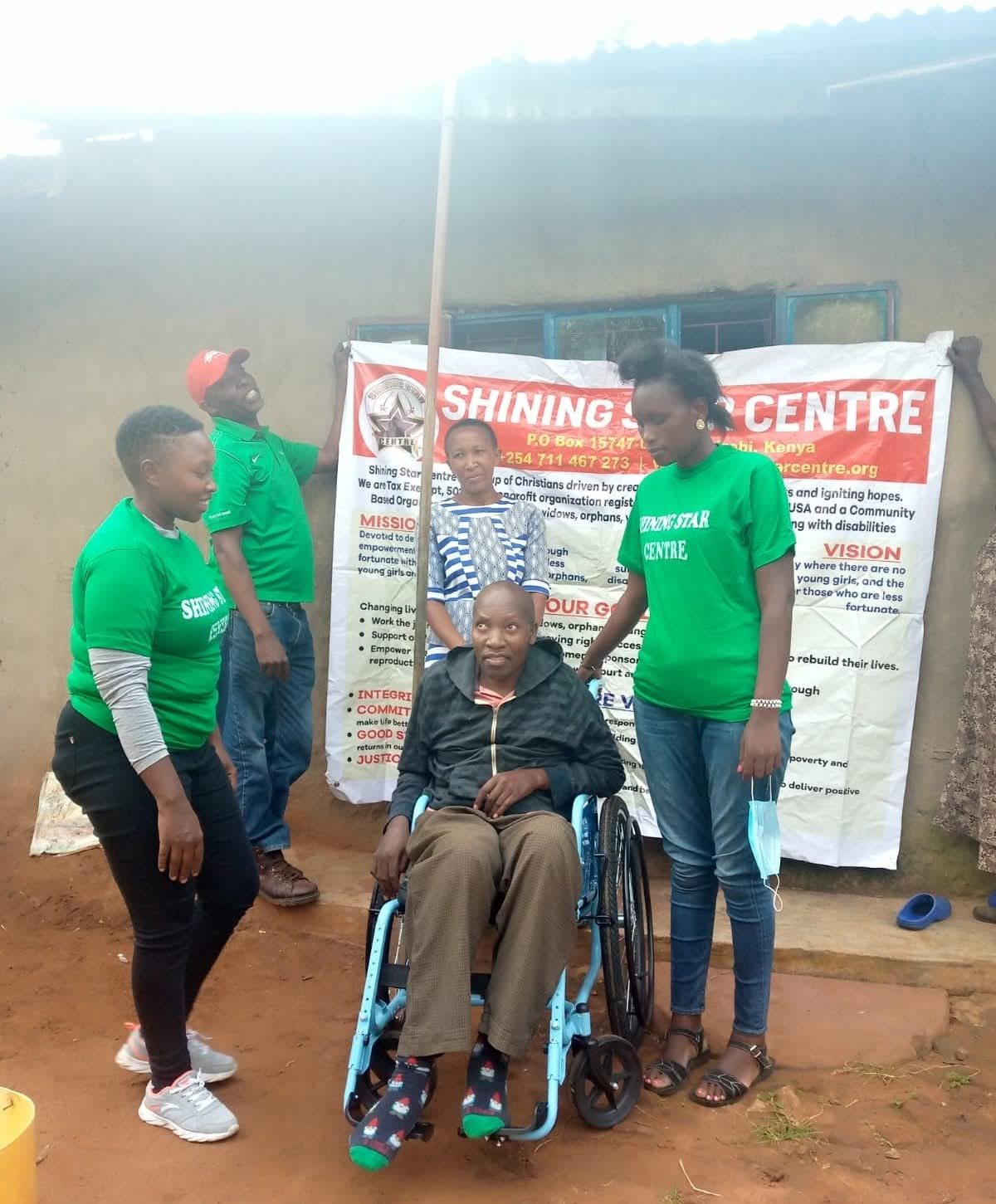 Shining Star Centre volunteers supporting a community member with a disability
